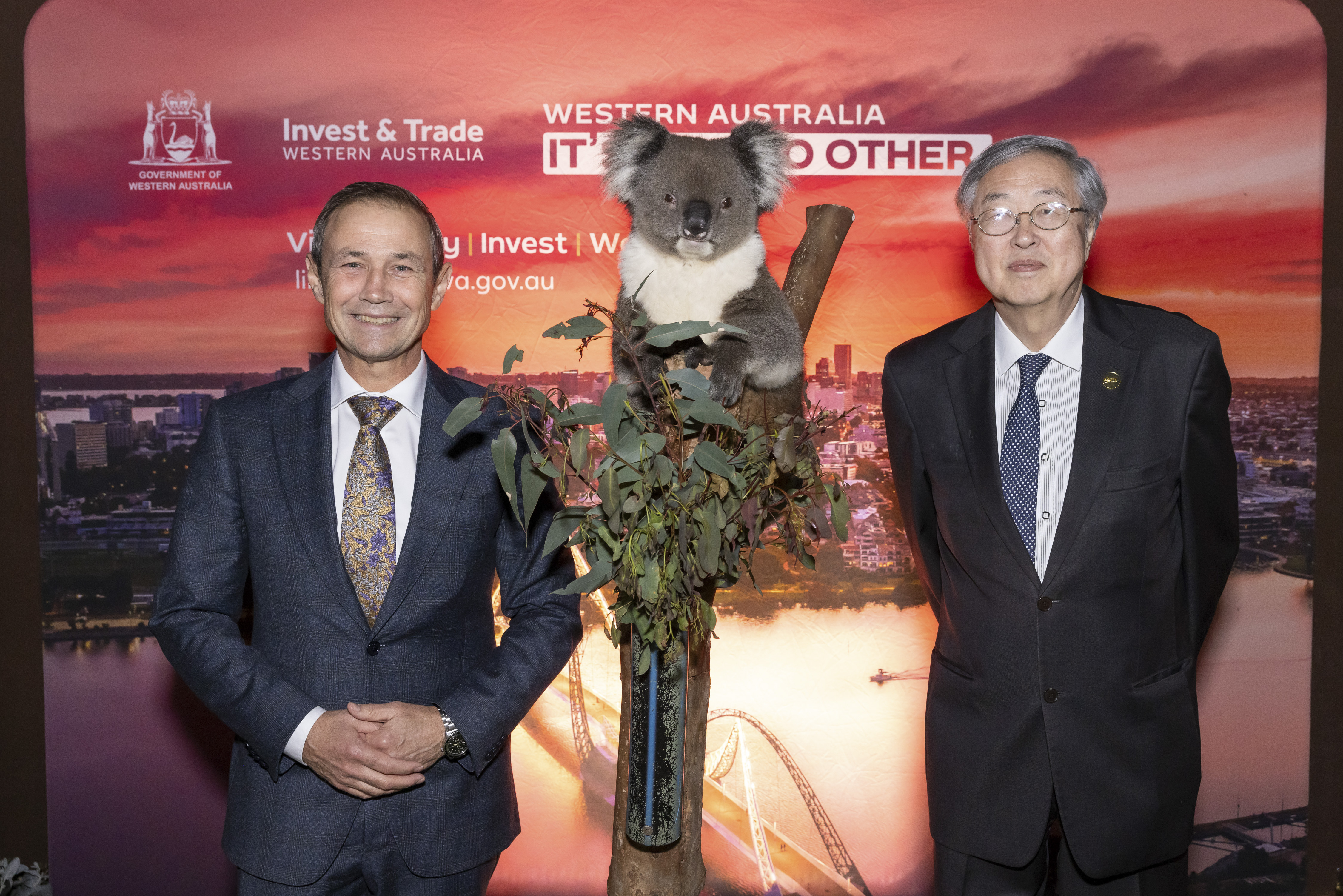 Premier Cook and H.E. Zhou Xiaochuan, Vice Chairman of BFA standing next to a Koala 